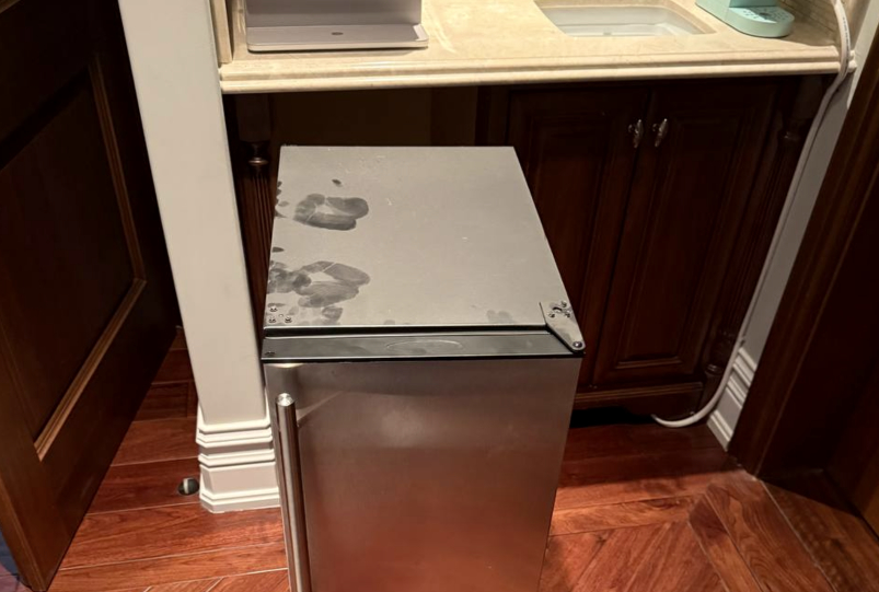 Cold beverage cooler pulled out for service after a cooling failure; condenser section cleaned and system restored in Katy, TX.